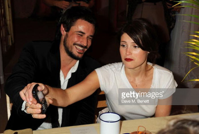 Stefano Catelli and his ex-wife Gemma Arterton attending a dinner party.